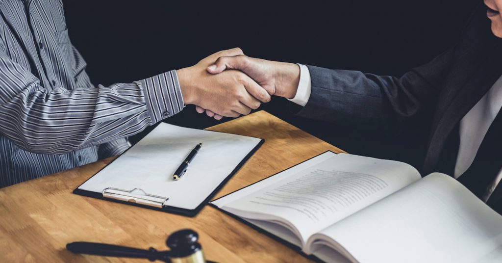 lawyer and client shaking hands