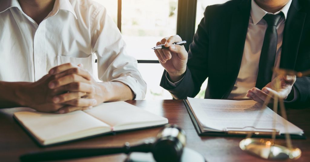 lawyer working with a client