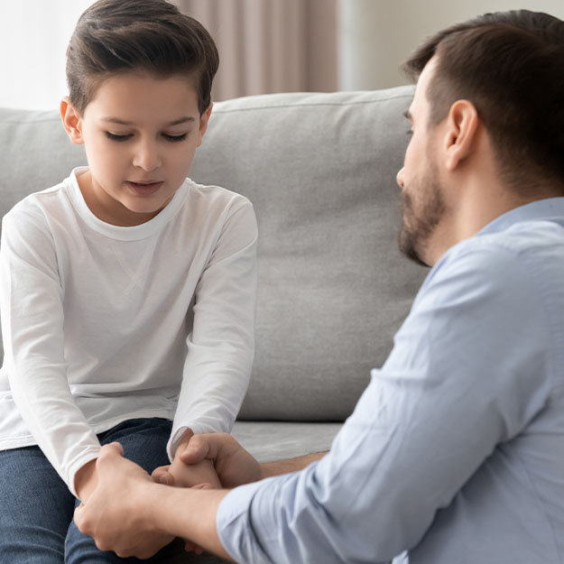 Father talking to his son about divorce.