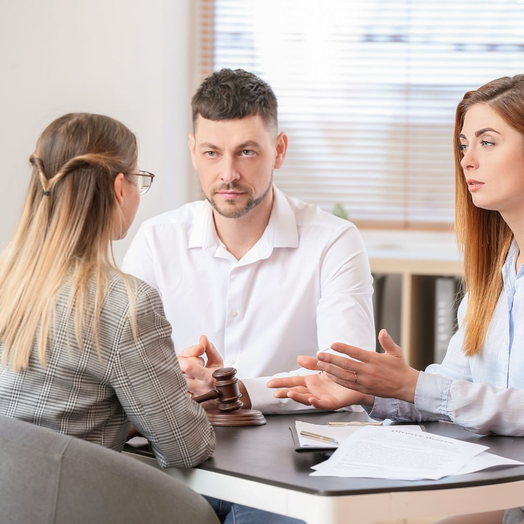 a couple talking to an attorney