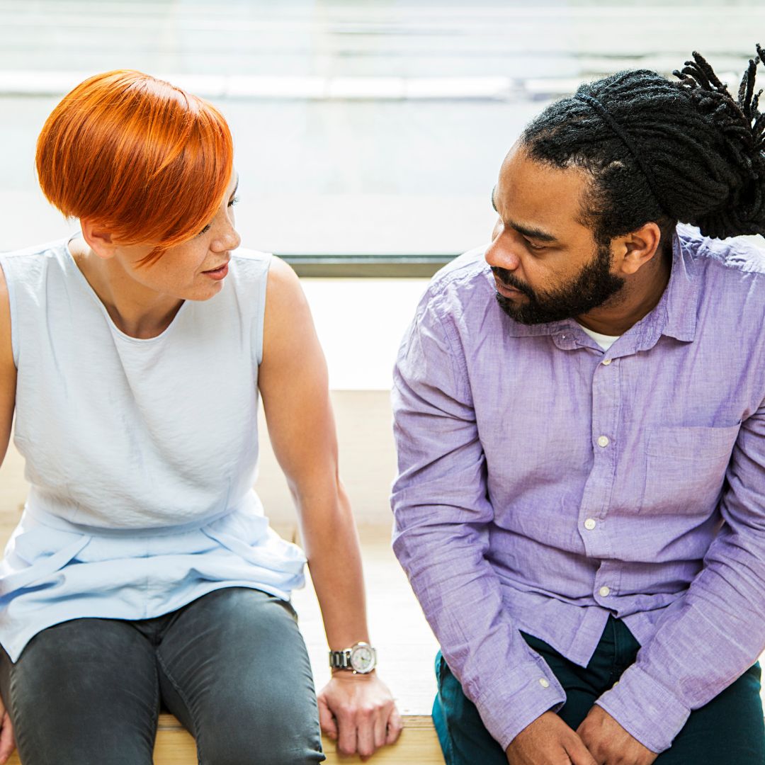 a man and a woman talking to each other