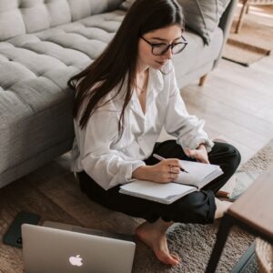 Person writing in a notebook