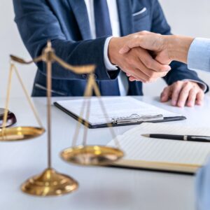 Attorney and client shaking hands