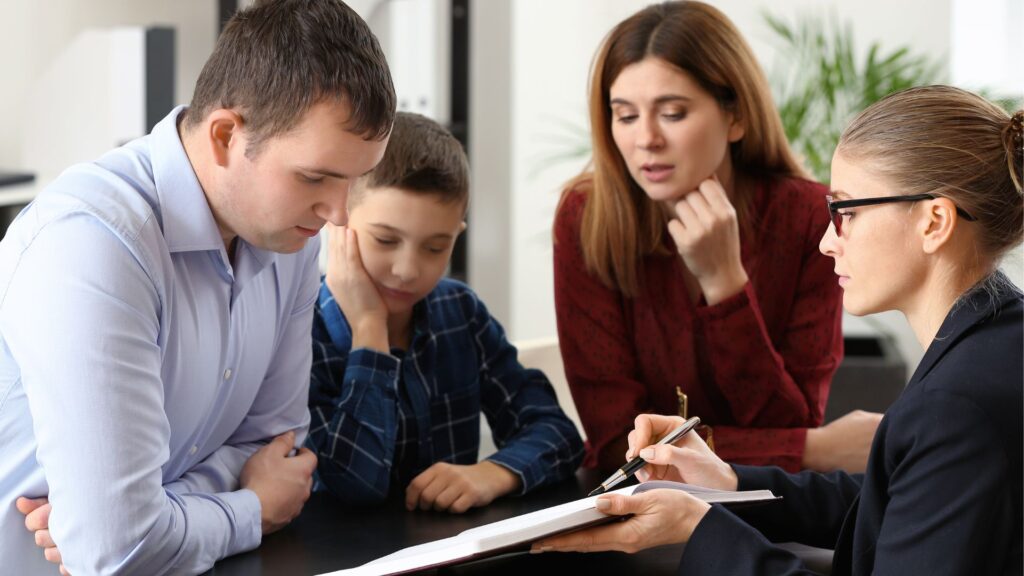 parents and child talking with lawyer