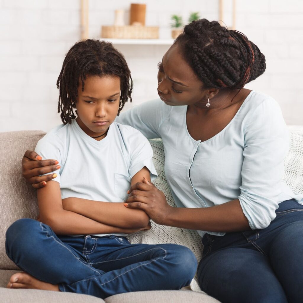 mother supporting her child during co-parenting transition