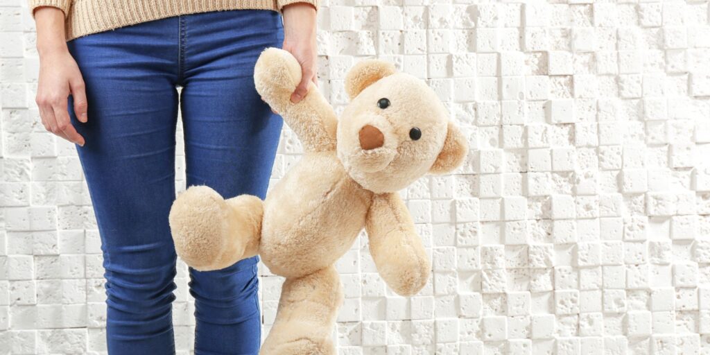 parent holding childs toy