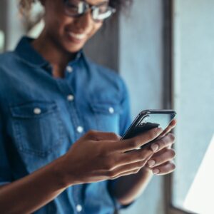a woman looking at a cell phone