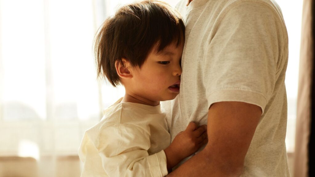 dad hugging his child