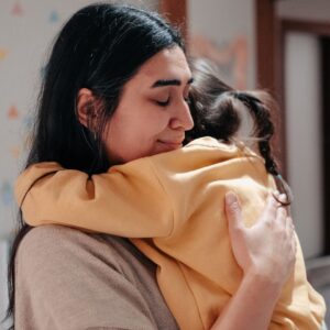 custody decision - NJ mother hugging child
