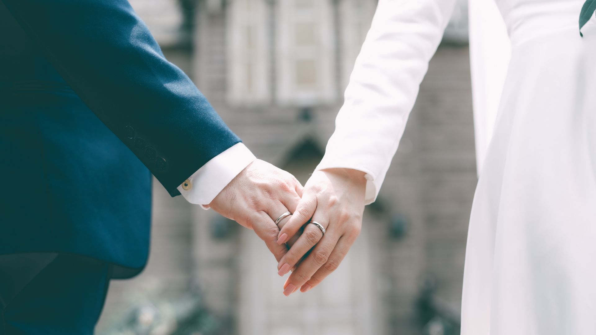 A couple holding hands.