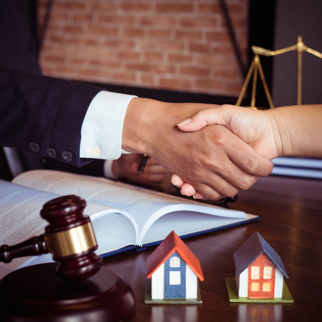 divorce lawyer shaking hands with a client
