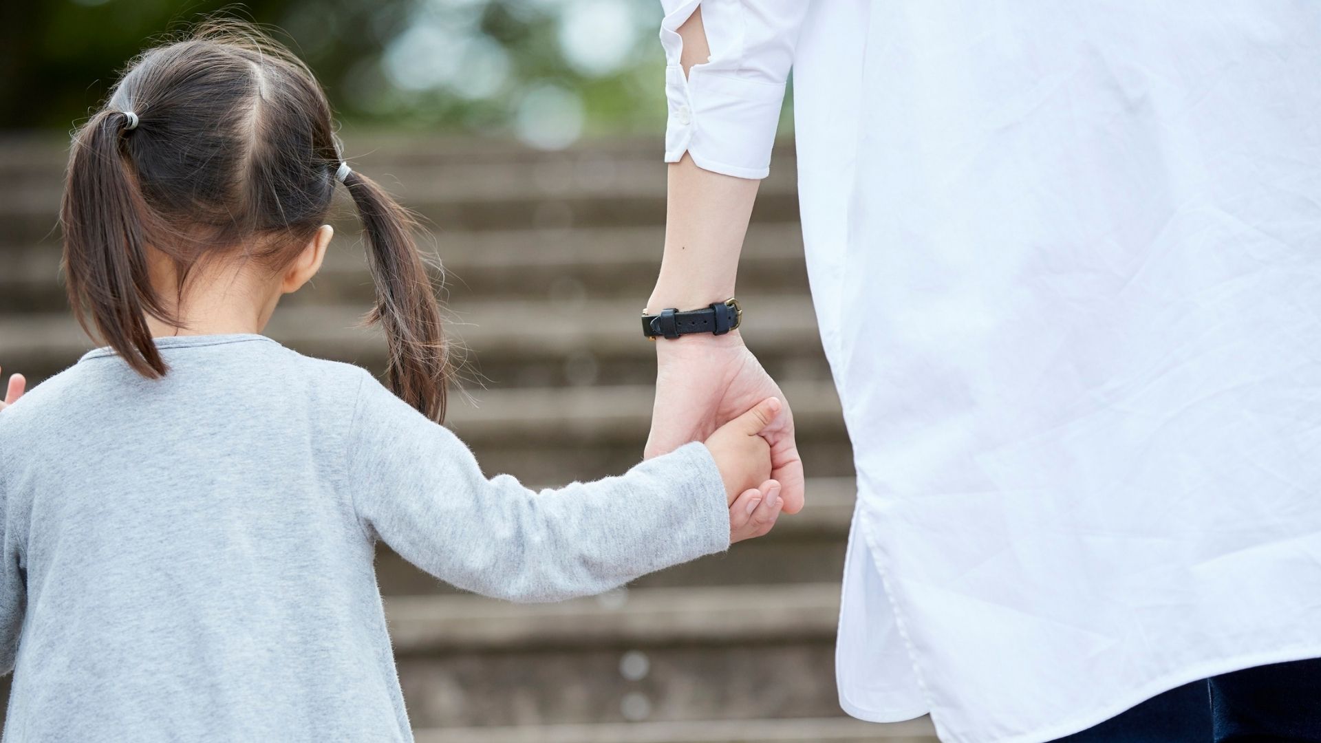 dad holding his child's hand
